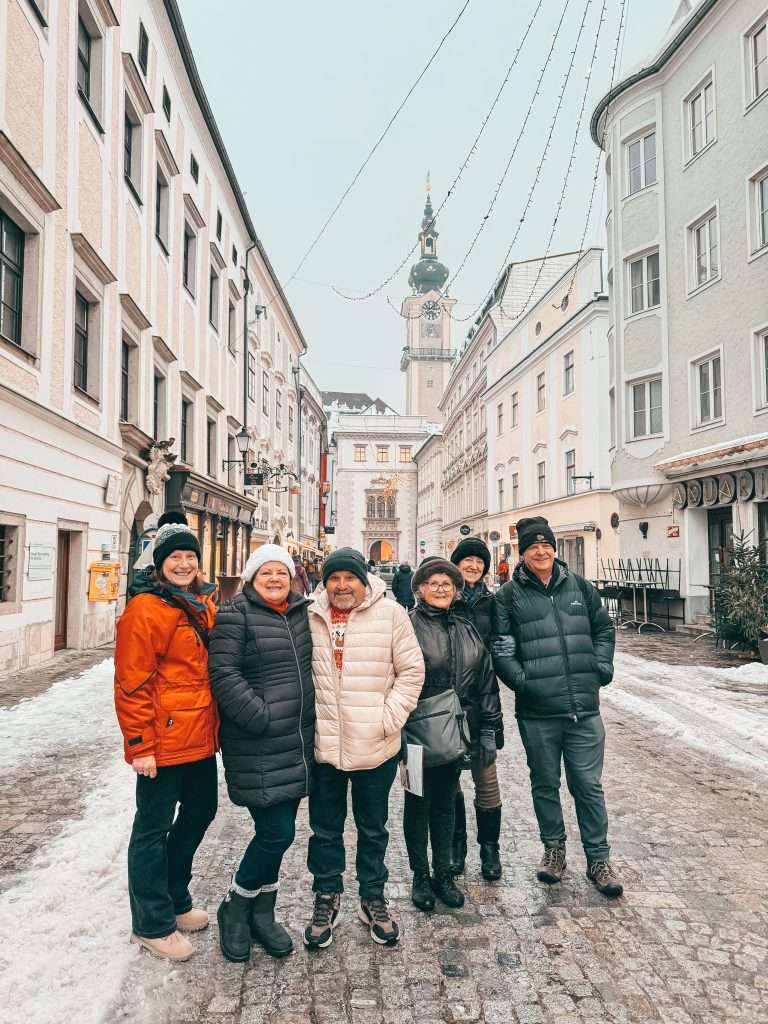 Christmas streets and sparkling markets in Linz, adorned with festive lights, colorful decorations, and bustling holiday stalls creating a magical holiday atmosphere. Seeds of Travel group