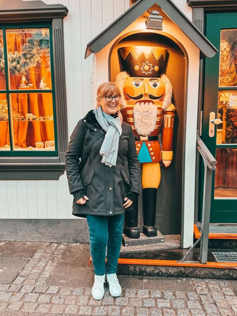 Cologne Christmas Markets with charming wooden stalls, twinkling lights, and festive decorations, set against the backdrop of the impressive Cologne Cathedral. Fun Seeds of Travel