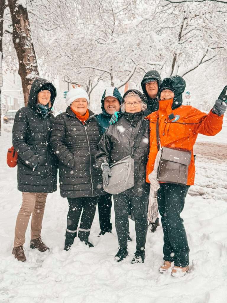 Our group bundled up in jackets and beanies, enjoying the snowy Munich weather with snowflakes gently falling around us