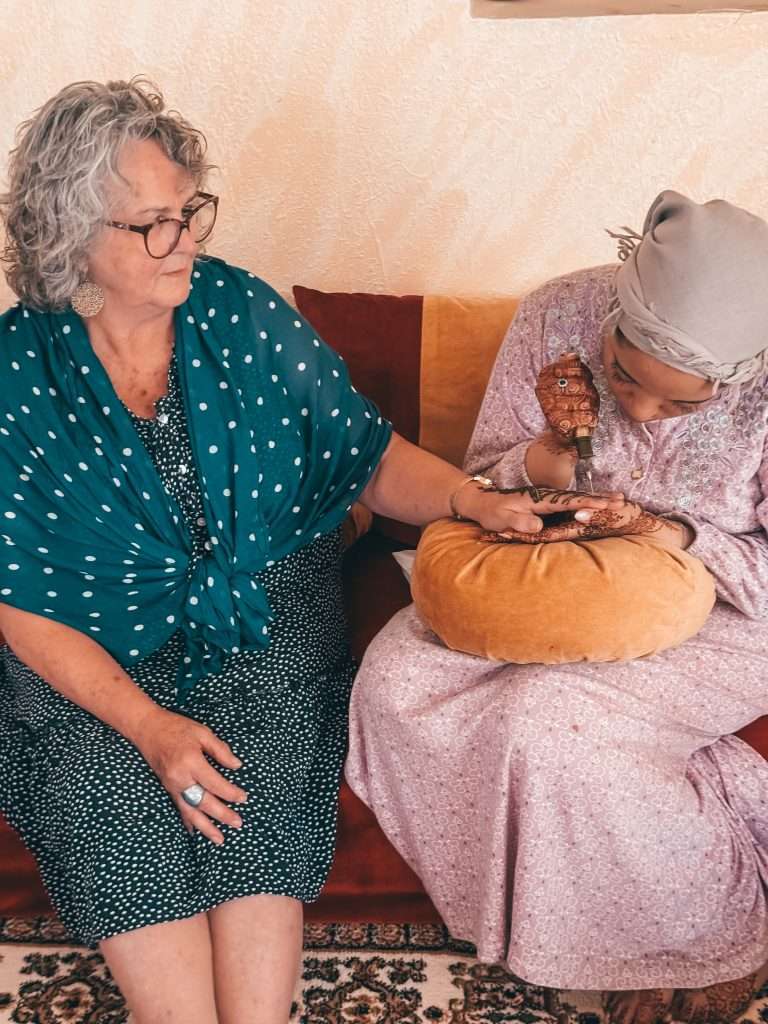 Painting Henna on hands Morocco