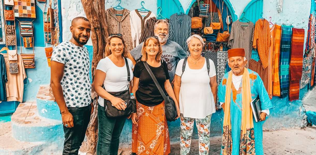 Small group standing together in the streets of Chefchaouen Morocco