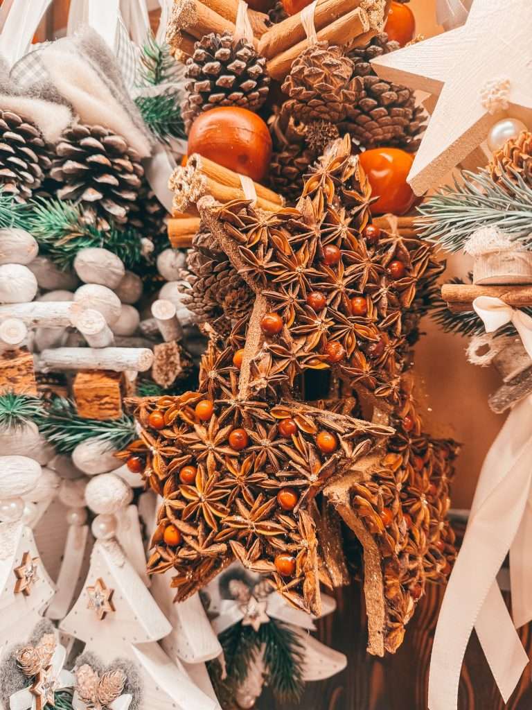 Festive Christmas decorations at the Munich Christmas Markets, featuring twinkling lights, colorful ornaments, and charming wooden stalls adorned with holiday garlands