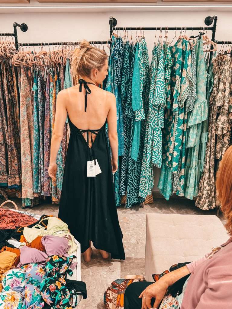 Shopping lady in dress shop trying on clothes Naoussa Paros Greece